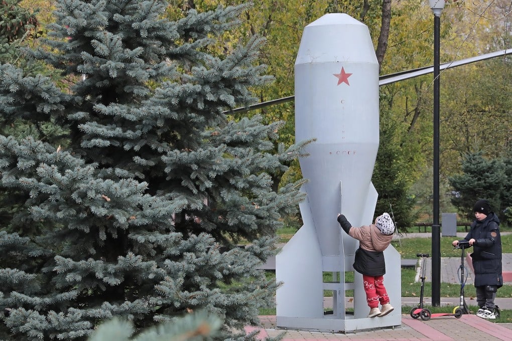 Children play at a Moscow monument dedicated to the first mass produced Soviet tactical nuclear bomb. Photo: EPA-EFE