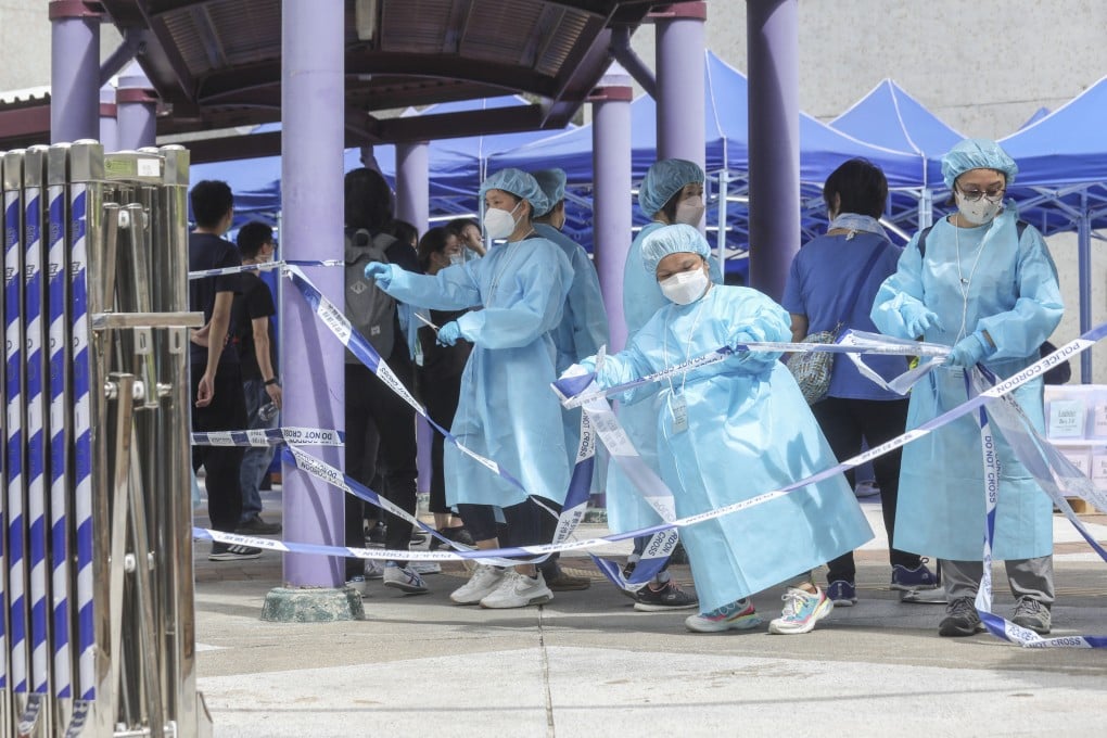 Medical workers end a Covid-19 testing order at a residential building in Kwun Tong in July. Photo: Xiaomei Chen