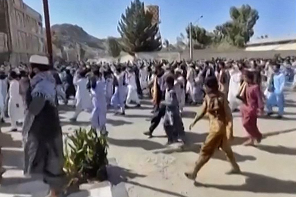 Iranian protesters chant slogans as they march in a street in the southeastern city of Zahedan on October 14. Cities across Iran have seen protests since 22-year-old Iranian woman Mahsa Amini died on September 16 after her arrest by the morality police in Tehran for allegedly failing to observe the Islamic republic’s strict dress code for women. Photo: AFP