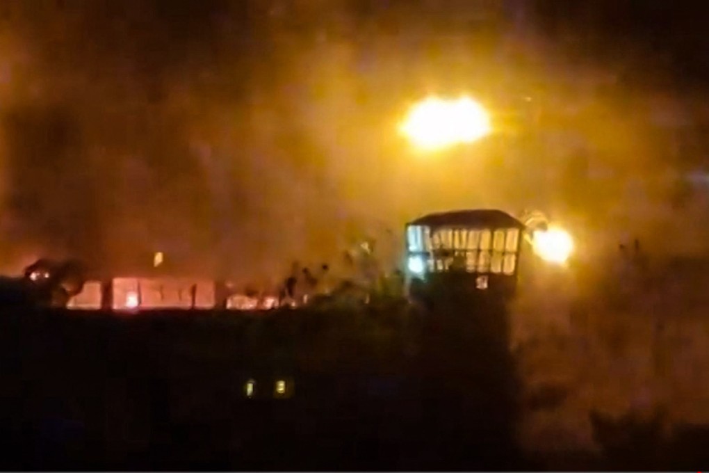 An image from a video reportedly shows flames and thick smoke rising from the Evin prison in the northwest of the Iranian capital Tehran. Photo: UGC/AFP