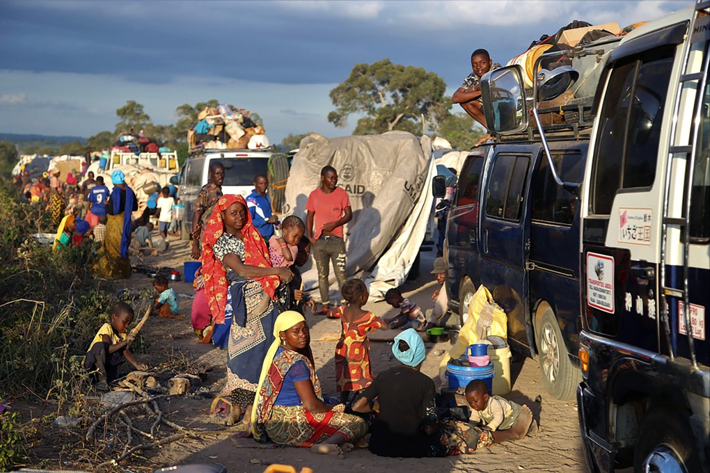 People displaced by the conflict in Cabo Delgado wait next to a truck on the outskirts of Mueda, Mozambique, to be transported to reach Palma. Photo: Doctors Without Borders via AP