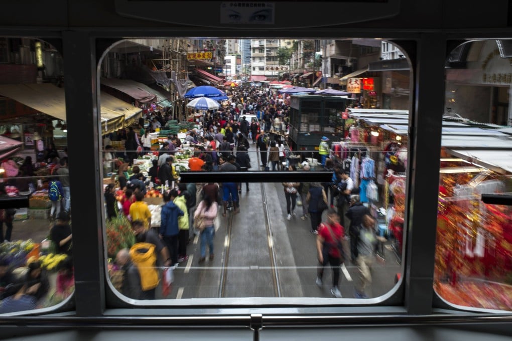 A view from a tram passing through the crowded Chun Yeung Street market in North Point, Hong Kong, on the eve of the Lunar New Year holiday in 2018. Photo: AFP