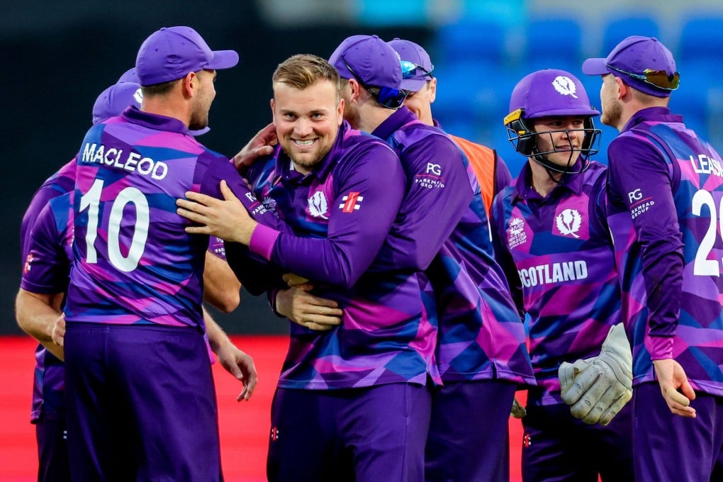 Scotland’s Mark Watt (centre) celebrates with teammates during their T20 World Cup game against the West Indies. Photo: AFP