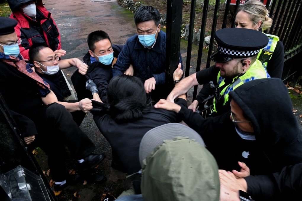 A scuffle erupts at the gate of the Chinese consulate in Manchester amid a demonstration over Chinese President Xi Jinping. Photo: Reuters