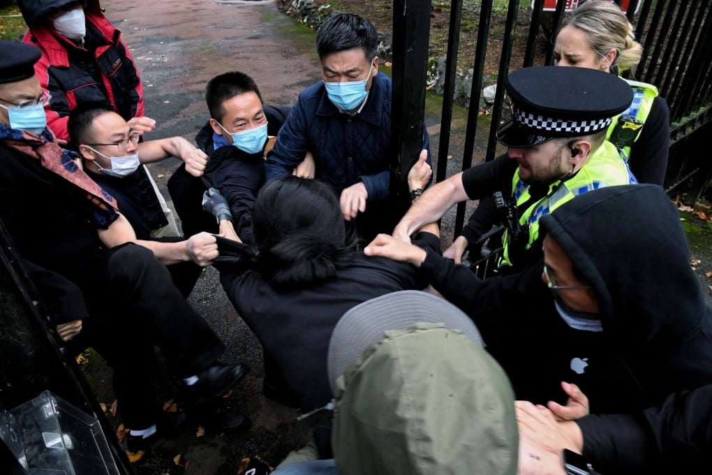 A scuffle erupts at the gate of the Chinese consulate in Manchester amid a demonstration over Chinese President Xi Jinping. Photo: Reuters