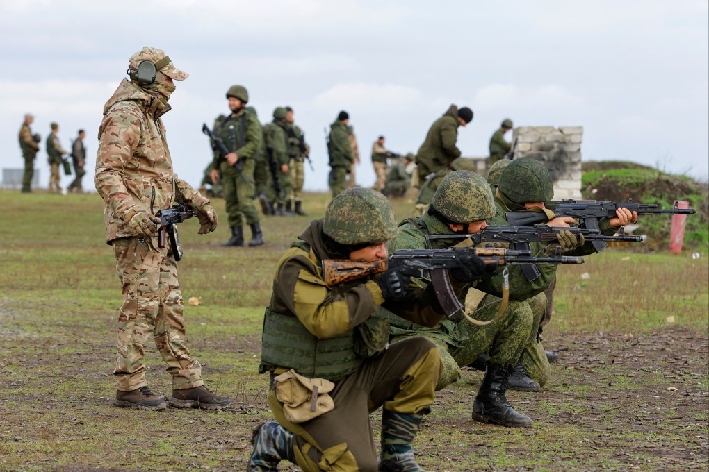 An instructor trains newly mobilised Russian reservists at a shooting range in the Donetsk region, Russian-controlled Ukraine. Photo: Reuters