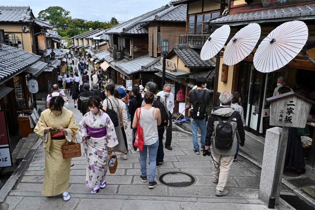 Visitors walk along one of the lanes filled with touristy shops and restaurants leading to Kiyomizu-dera temple in Kyoto. Photo: AFP