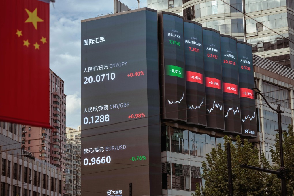 A large screen shows stock and currency exchange data in Shanghai on September 29. China’s yuan hit a record low against the US dollar on September 28, the weakest since the global financial crisis in 2008, despite the central bank taking steps to rein in the currency’s weakness. Photo: EPA-EFE