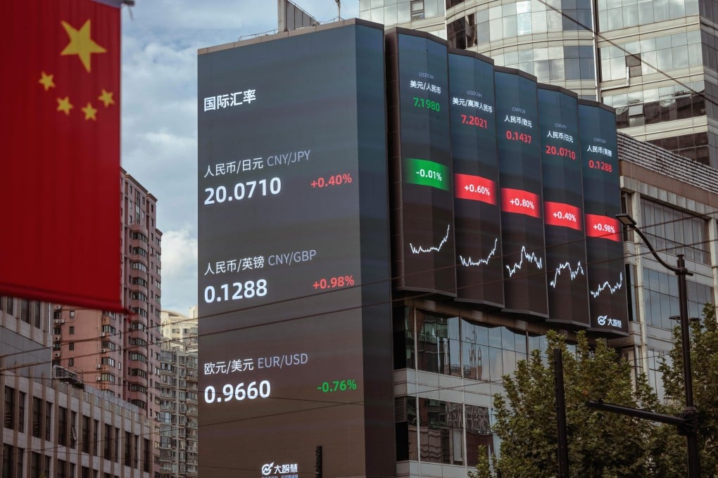 A large screen shows stock and currency exchange data in Shanghai on September 29. China’s yuan hit a record low against the US dollar on September 28, the weakest since the global financial crisis in 2008, despite the central bank taking steps to rein in the currency’s weakness. Photo: EPA-EFE