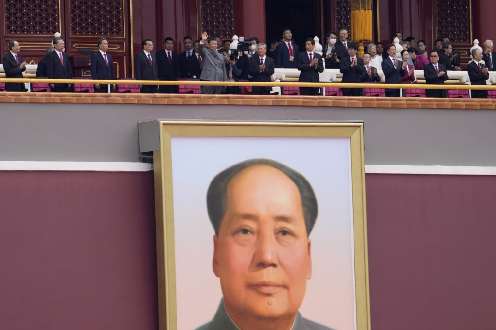 Chinese President Xi Jinping, centre, waves above a large portrait of the late leader Mao Zedong during a ceremony to mark the 100th anniversary of the founding of the ruling Chinese Communist Party at Tiananmen Gate in Beijing in 2021. Photo: AP Photo
