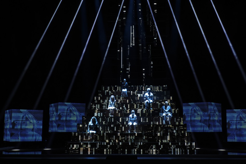 Singers perform amid projected visuals in Chasing Waterfalls, an opera that explores the blurring of boundaries between the real and virtual worlds. Photo: Manfred Vogel