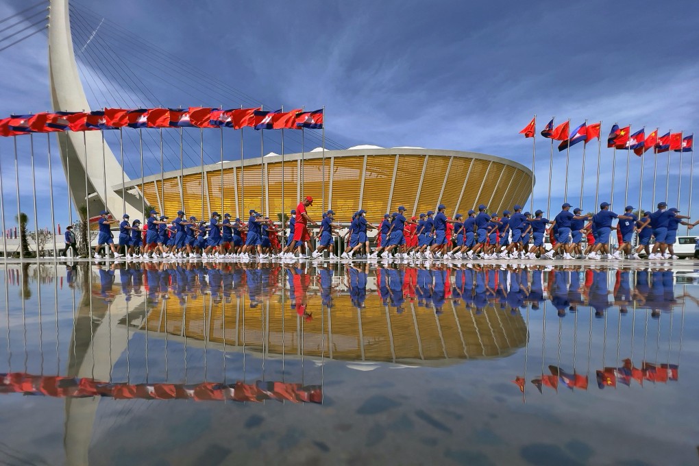 Marchers at the opening ceremony of Cambodia’s Morodok Techo National Stadium, which was funded by China under its Belt and Road Initiative. Photo: AFP