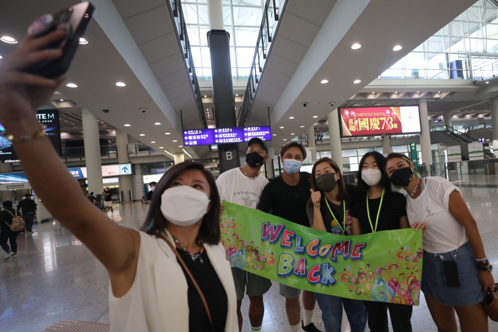 Passengers arrive at Hong Kong International Airport on October 7. While Hong Kong has taken some steps to loosen pandemic restrictions, those entering the city need to undergo a series of Covid-19 tests. Photo: Xiaomei Chen