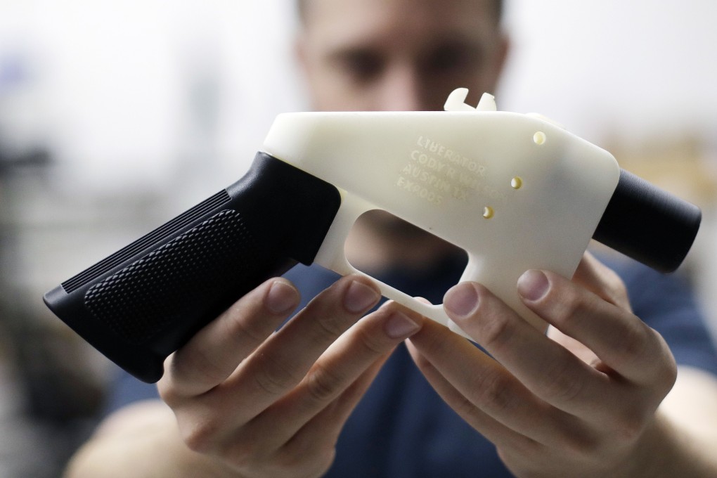 Cody Wilson holds a 3D-printed gun called the Liberator. File photo: AP