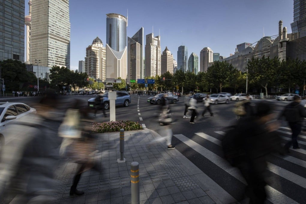 Pedestrians in the Lujiazui Financial District in Shanghai on October 10, 2022. Photo: Bloomberg