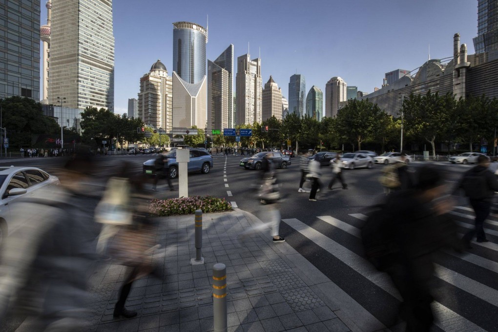 Pedestrians in the Shanghai’s financial district if Lujiazui on Monday. Photo: Bloomberg