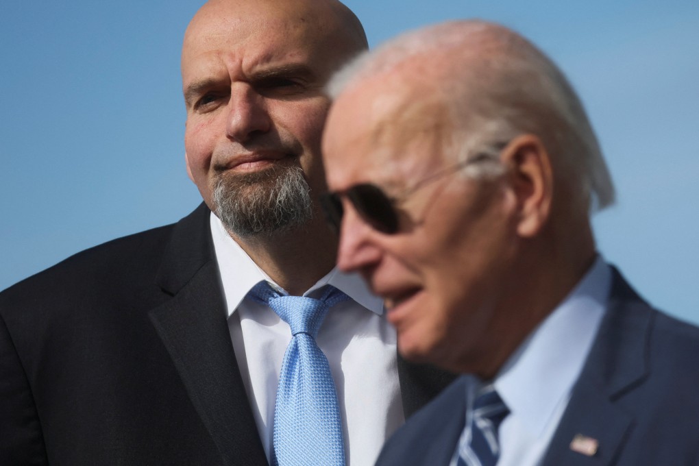 Pennsylvania Lieutenant Governor John Fetterman stands next to US President Joe Biden at the Pittsburgh International Airport. Photo: Reuters