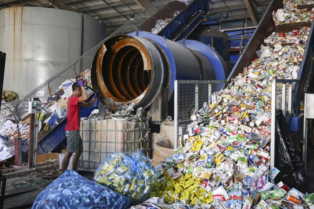 A worker operates machinery at Mil Mill, Hong Kong’s only recycling plant dedicated to beverage cartons, on September 15 in Yuen Long. Photo: K. Y. Cheng