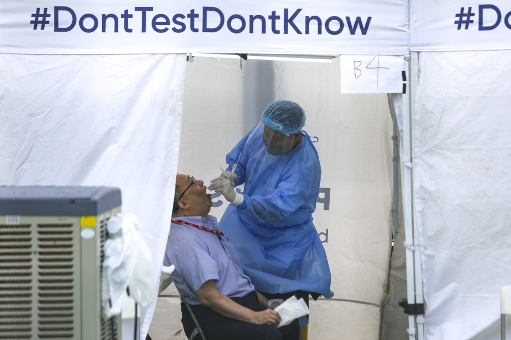 A man is tested for Covid-19 at the Community Testing Station at the North Point Vehicular Ferry Pier Playground. Photo: Xiaomei Chen