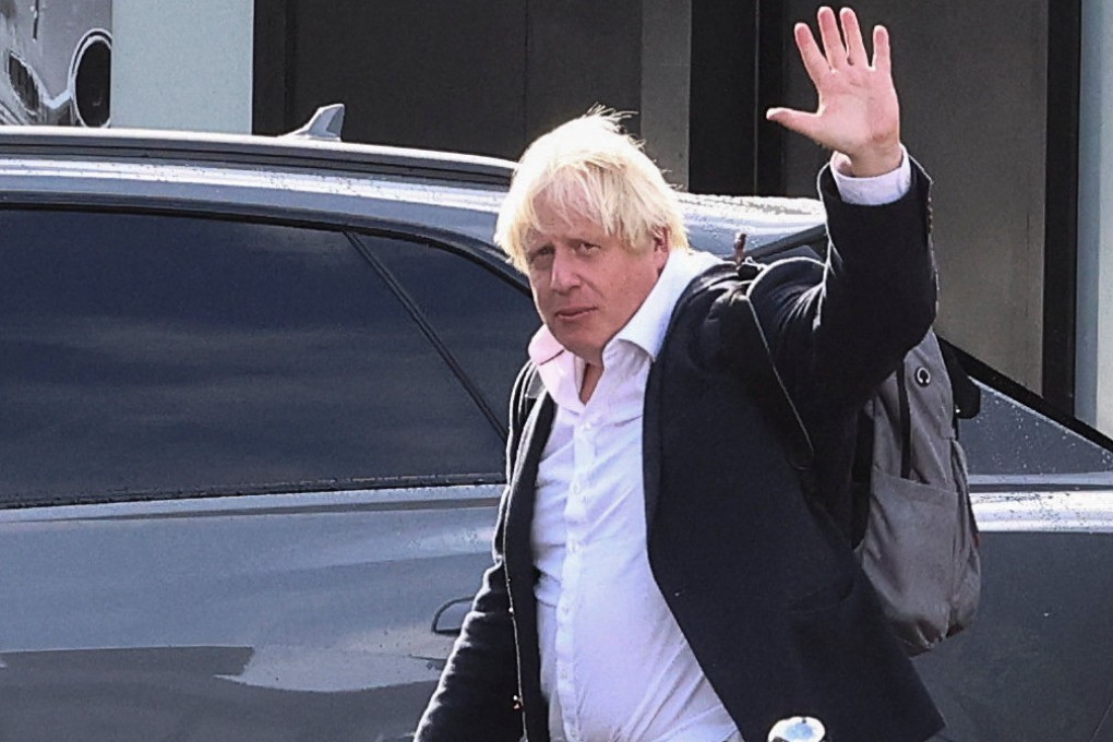 Former British Prime Minister Boris Johnson at Gatwick Airport after returning from his holiday. Photo: Reuters