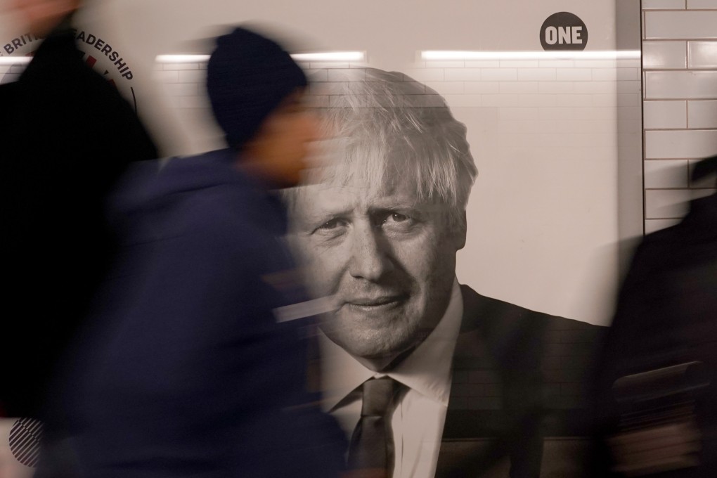 The face of former British prime minister Boris Johnson appears on an ad in Westminster tube station in London on Friday. Photo AP