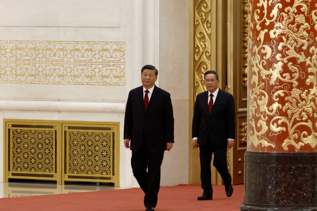 President Xi Jinping and Li Qiang are the first to arrive as Politburo Standing Committee members file out to be introduced to the press following the 20th Communist Party congress, at Beijing’s Great Hall of the People on October 23. Photo: Reuters
