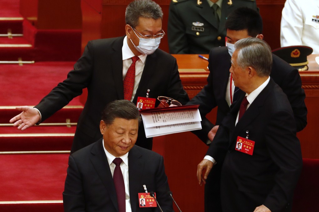 China’s former President Hu Jintao (R) is led out as President Xi Jinping (L) looks on during the closing ceremony of the 20th National Congress of the Communist Party of China. Photo: EPA-EFE
