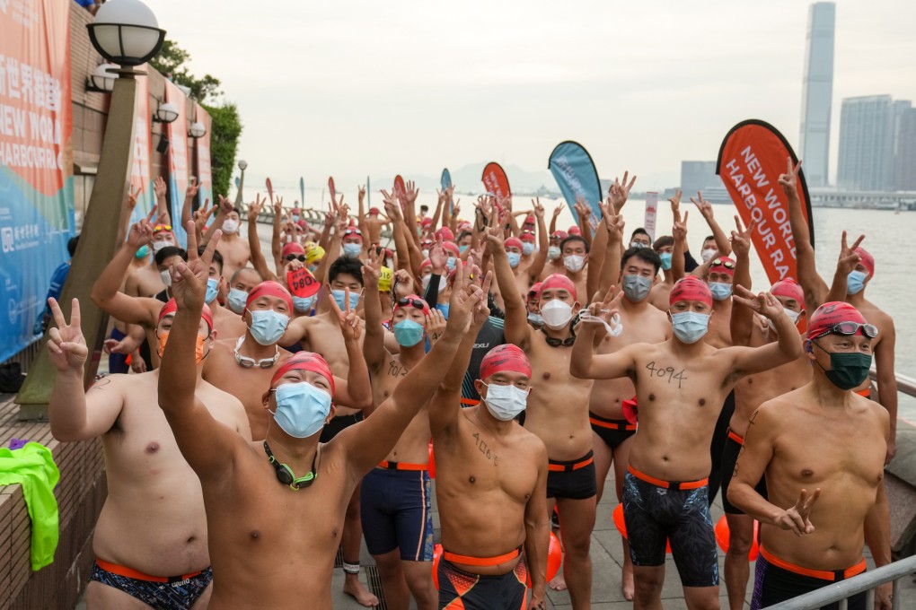 Swimmers get ready to enter the water at Golden Bauhinia Square in Wan Chai at the start of the New World Harbour Race. Photo: Sam Tsang