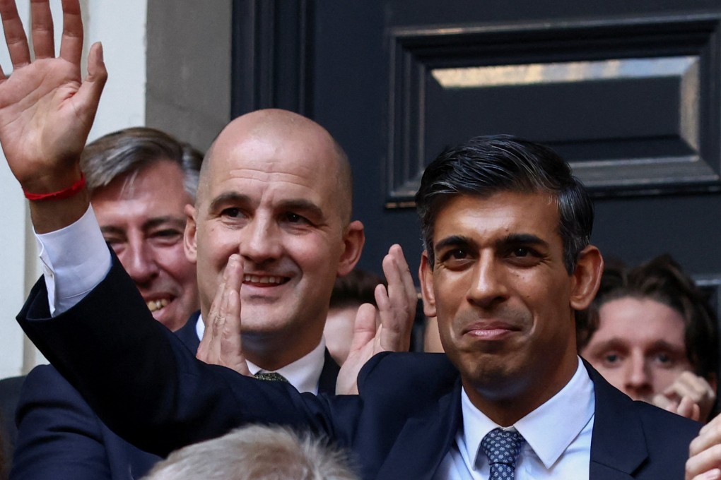 New leader of Britain’s Conservative Party Rishi Sunak waves outside the party’s headquarters in London on Monday. Photo: Reuters
