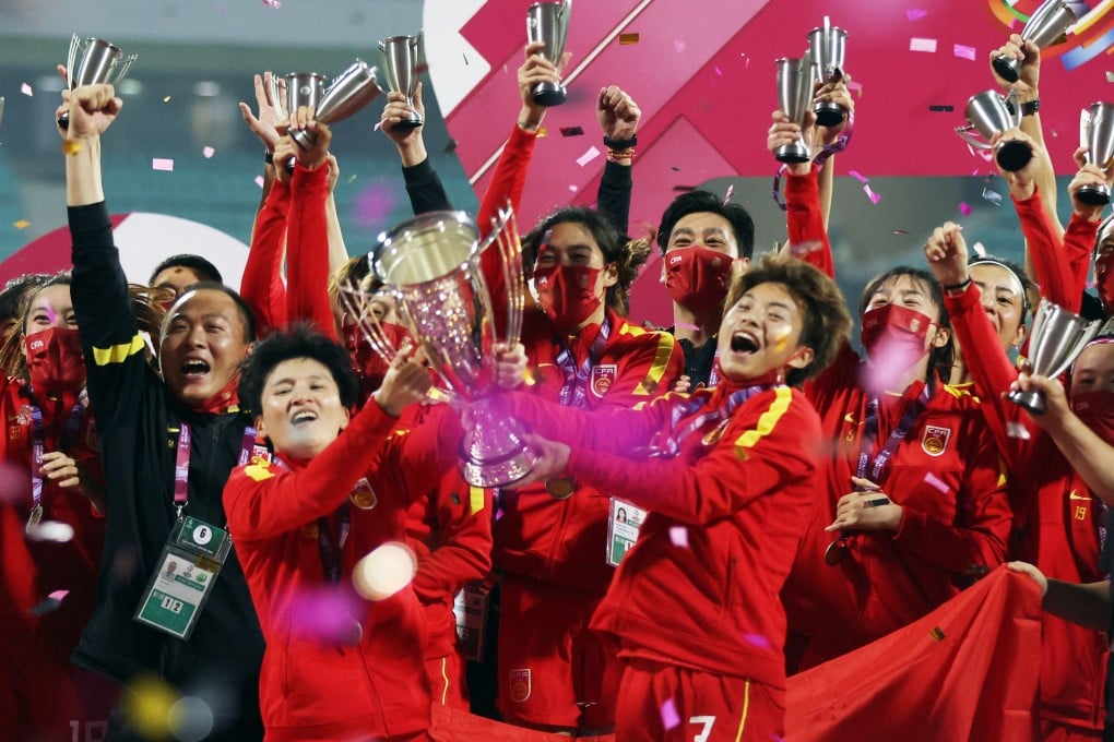 China’s Wang Shuang and Wang Shanshan hold the trophy and celebrate with their team after beating South Korea in the final of the 2022 AFC Women’s Asian Cup. Photo: Reuters