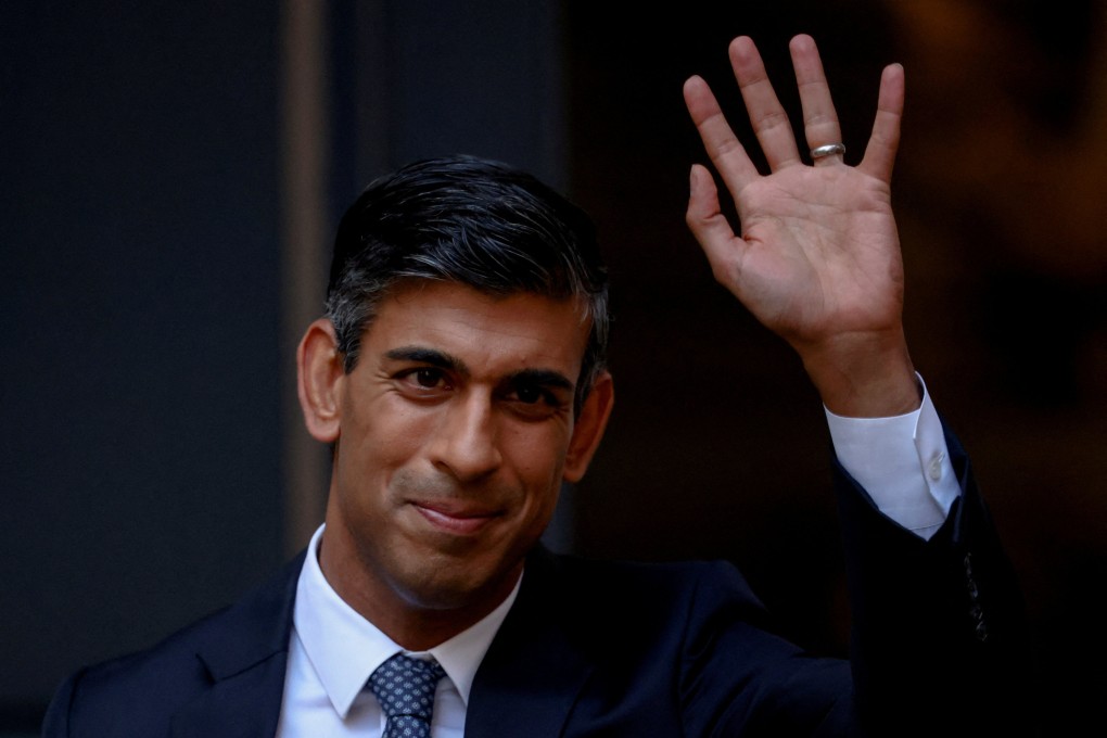 New leader of Britain’s Conservative Party Rishi Sunak waves outside the party’s headquarters in London. Photo: Reuters