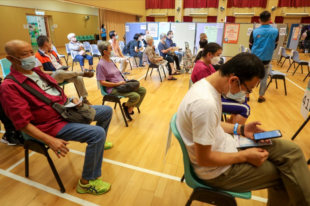 Residents wait in Sau Mau Ping to get their Covid-19 vaccine jabs. Photo: Xiaomei Chen