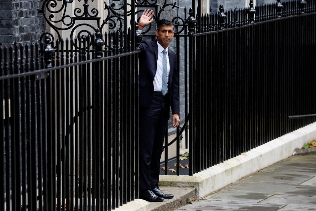 Britain’s new Prime Minister Rishi Sunak waves outside Number 10 Downing Street, in London. Photo: Reuters