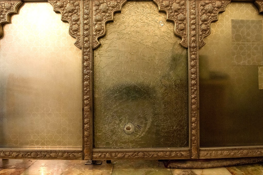 A bullet hole in a wall at the Shah Cheragh Shrine in Shiraz, Iran, where the attack occurred on Wednesday evening. Photo: Reuters