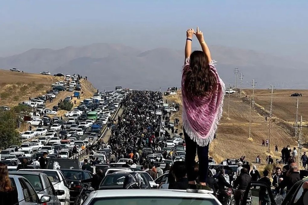 A large number of people walk to the cemetery where Mahsa Amini is buried in Saqez, in Iran’s Kurdistan province, on Wednesday. Photo: TNS