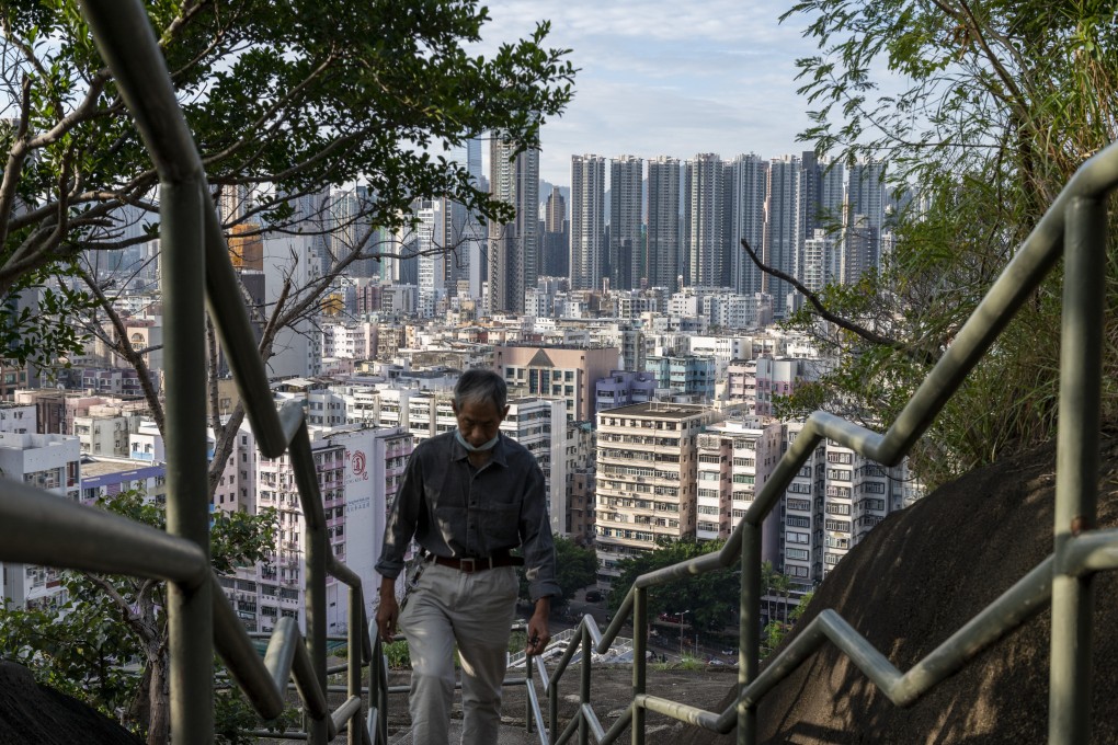 A man climbs steps near a residential area in Hong Kong on October 19. Photo: AP