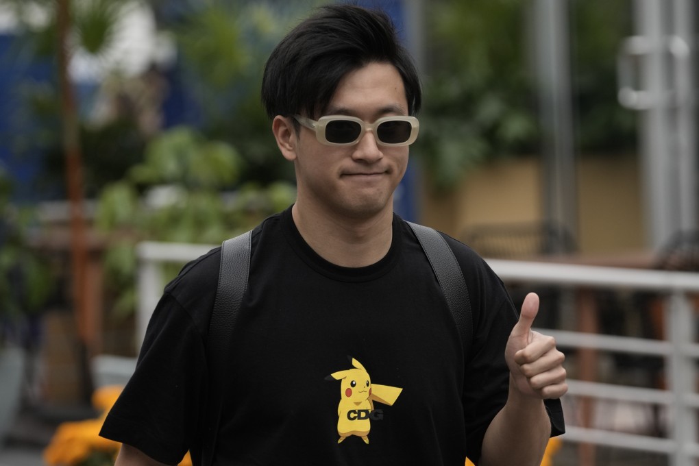 Zhou Guanyu gives a thumbs up upon his arrival for the first day of the Mexico Grand Prix. Photo: AP