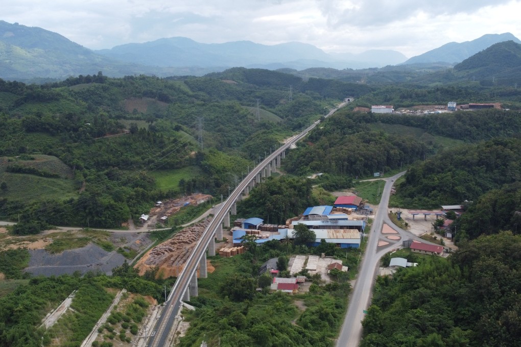 An aerial view of the China-Laos railway in Luang Prabang province, with deforested hills nearby. Photo: Aidan Jones