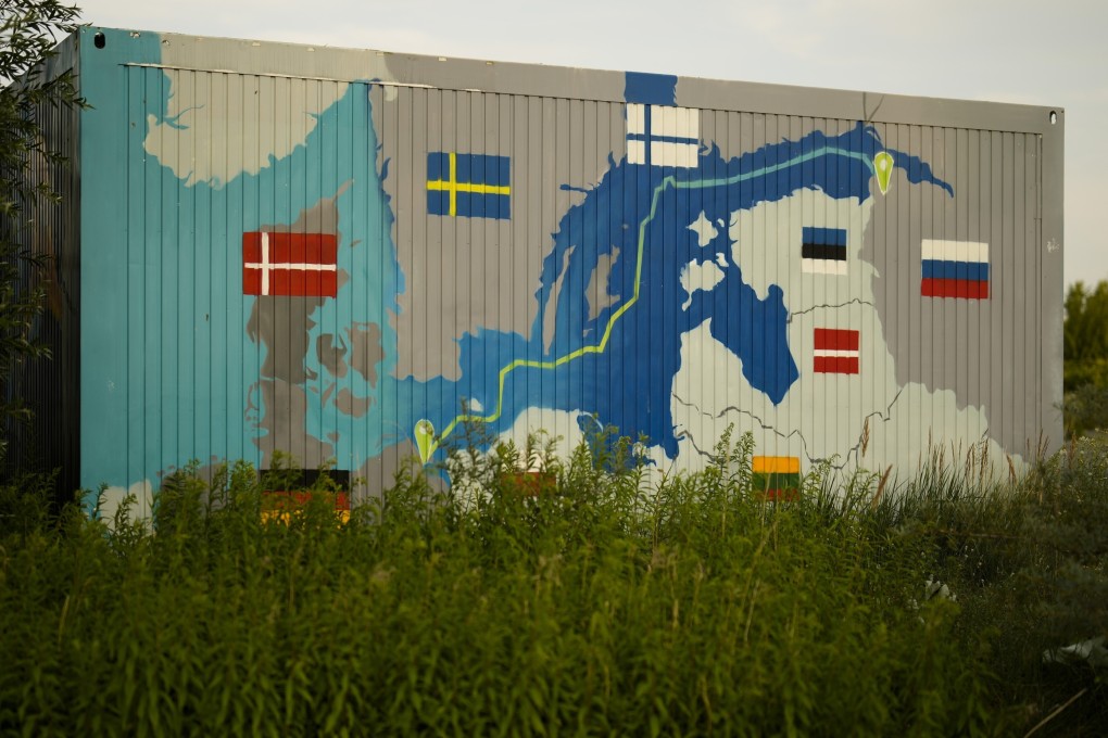 A painting showing the Nord Stream pipelines on a container near the Nord Stream 1 Baltic Sea pipeline in Lubmin, Germany, on July 20. The prospect of a winter plagued with power cuts is driving home the potential danger of weaponised interdependence to many in western Europe and beyond. Photo: AP