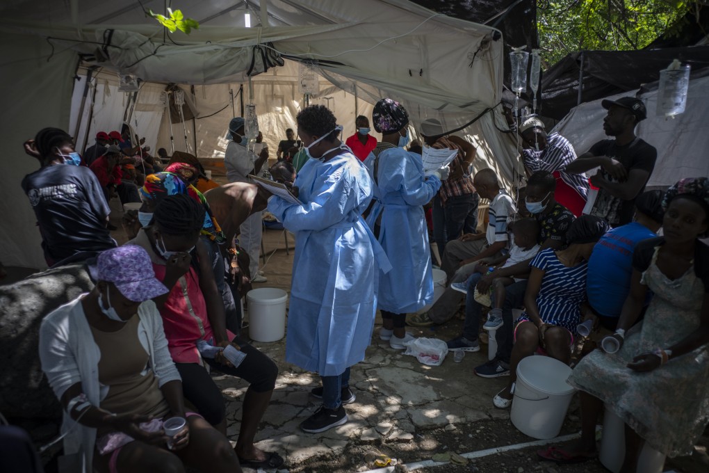 Medical personnel attend to patients with cholera symptoms at a clinic run by Medecins Sans Frontieres in Port-au-Prince, Haiti on Thursday. Photo: AP