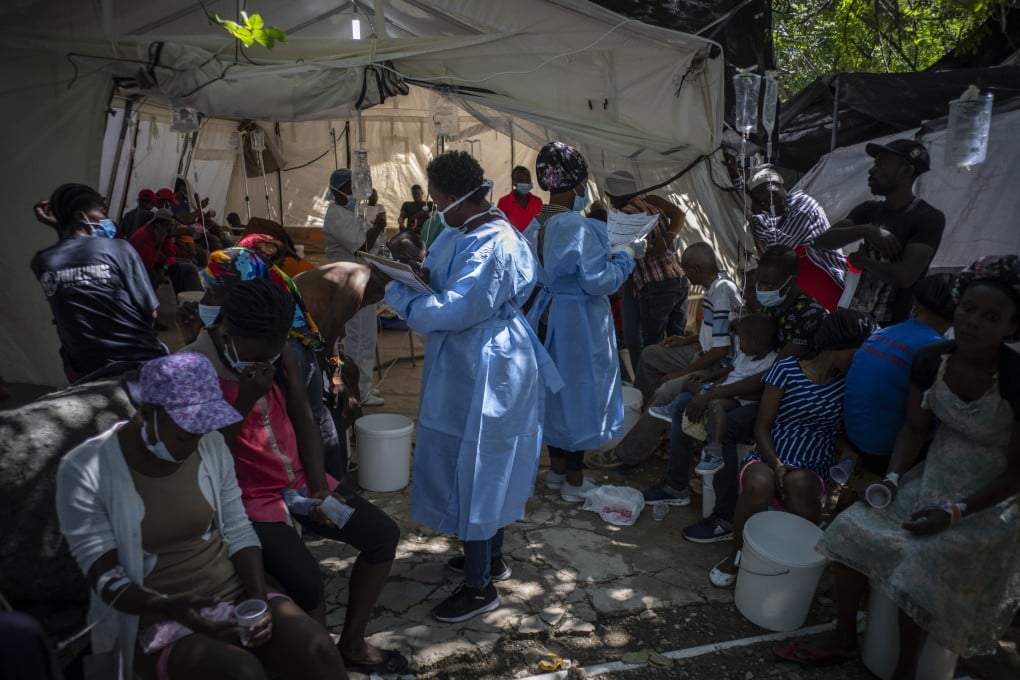 Medical personnel attend to patients with cholera symptoms at a clinic run by Medecins Sans Frontieres in Port-au-Prince, Haiti on Thursday. Photo: AP