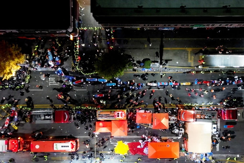 Rescue workers at the scene where a stampede during Halloween festivities killed and injured many people at the popular Itaewon district in Seoul, South Korea. Photo: Yonhap via Reuters