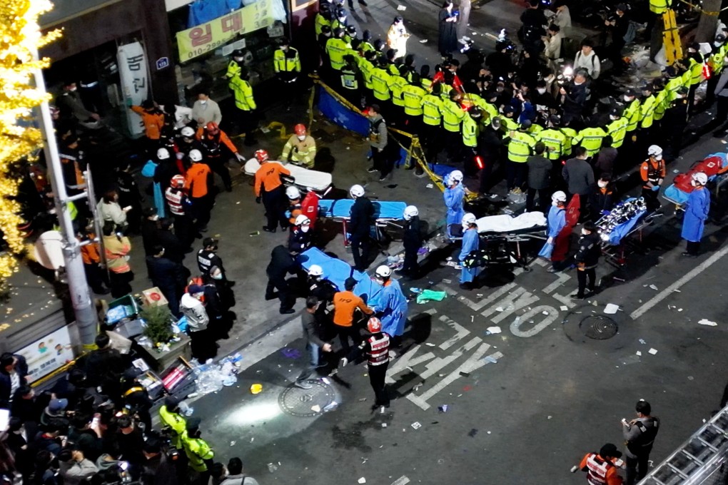 Rescue workers at the scene of the deadly stampede during Halloween festivities in Seoul’s popular  nightlife district of Itaewon. Photo: Reuters