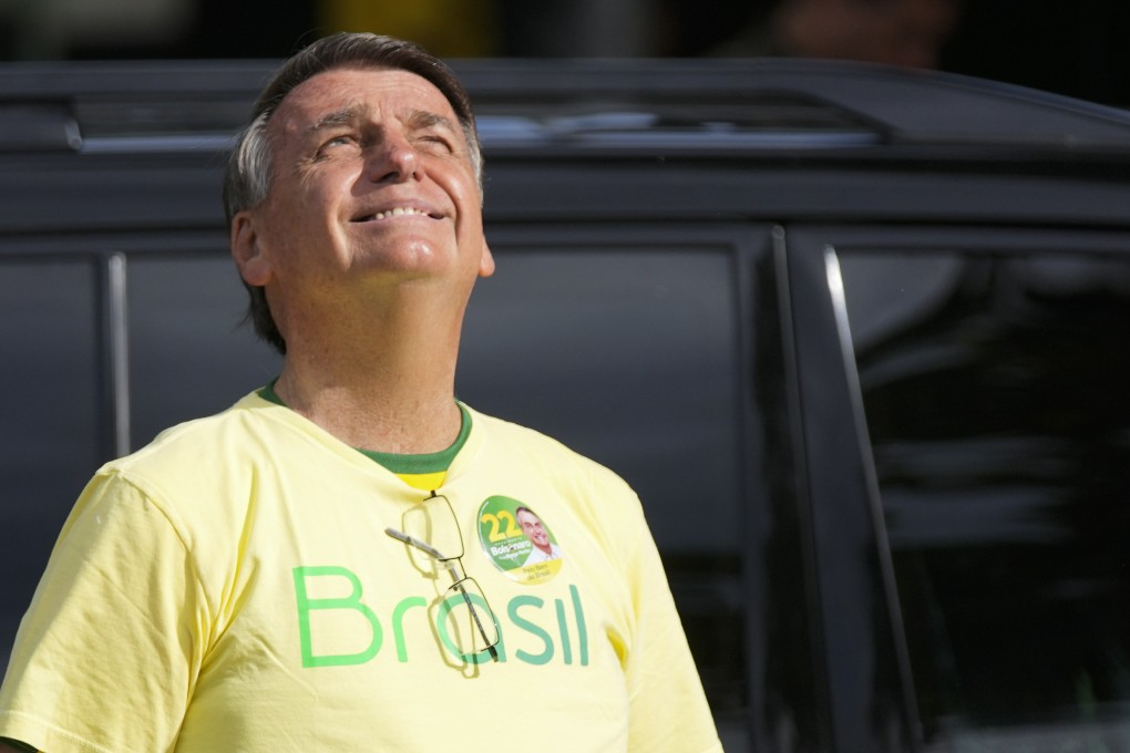 Brazilian President Jair Bolsonaro, who is running for another term, arrives to vote in a second round presidential election in Rio de Janeiro, Brazil on October 30. Photo: AP