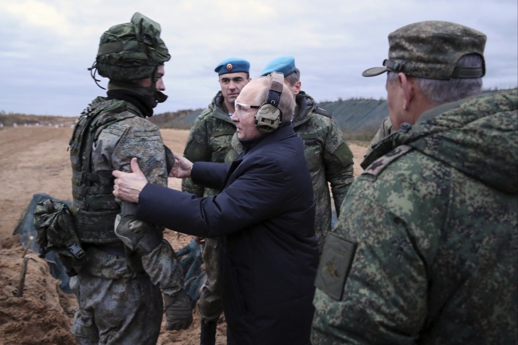 Russian President Vladimir Putin (centre) speaks to a soldier as he visits a military training centre for mobilised reservists in the Ryazan Region of Russia on October 20. Photo: AP
