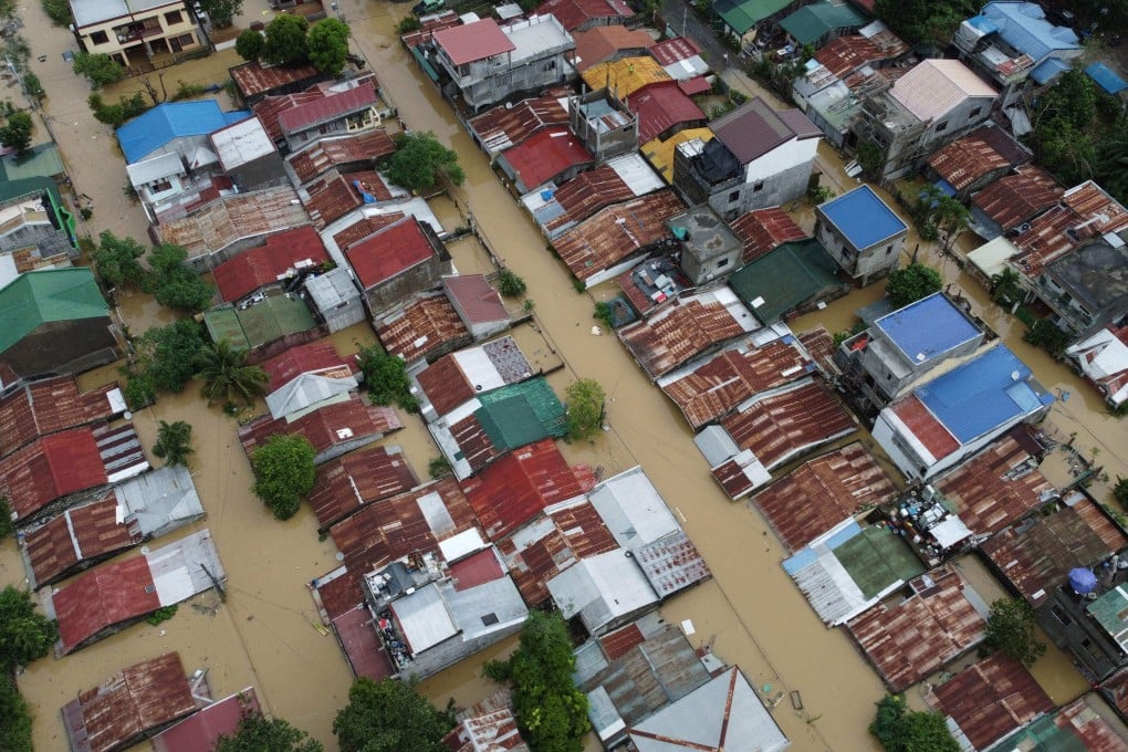Aerial view of flood-inundated houses in Alibagu, Ilagan city, Isabela province on Monday after Tropical Storm Nalgae hit the region. Photo: AFP