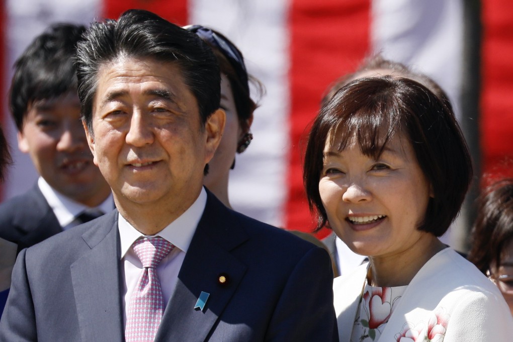 Late Japanese Prime Minister Shinzo Abe (L) and his wife Akie are seen during a cherry blossom viewing party in April 2019. Photo: EPA-EFE/File