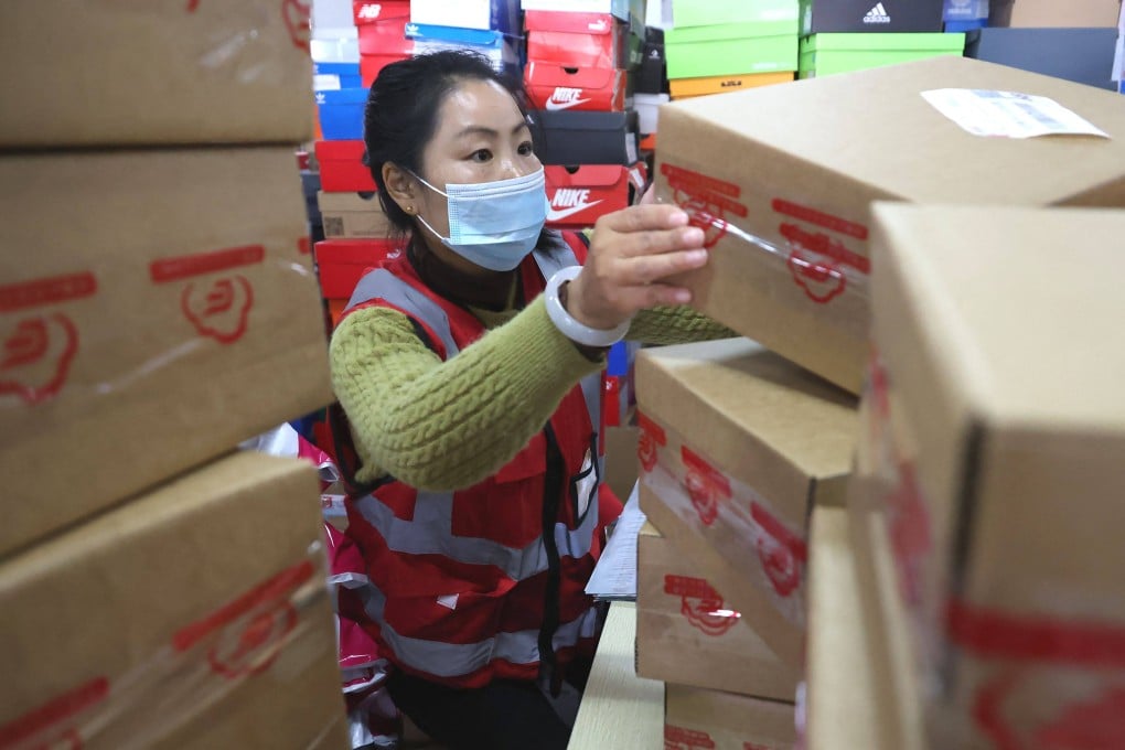 An employee sorts packages for delivery ahead of the Singles’ Day shopping festival at Tianma E-commerce Industrial Park in Lianyungang, Jiangsu province on Tuesday. Photo: AFP