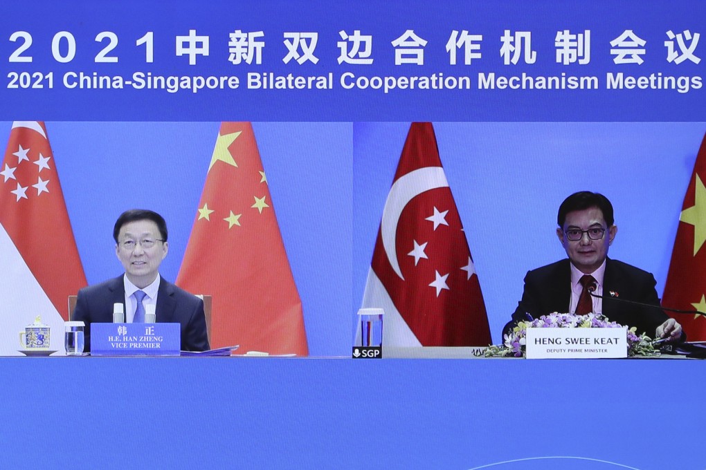 Chinese Vice-Premier Han Zheng (left) meets Singapore’s Deputy Prime Minister Heng Swee Keat via video link in Beijing in December 2021 in a series of bilateral meetings. Photo: Xinhua