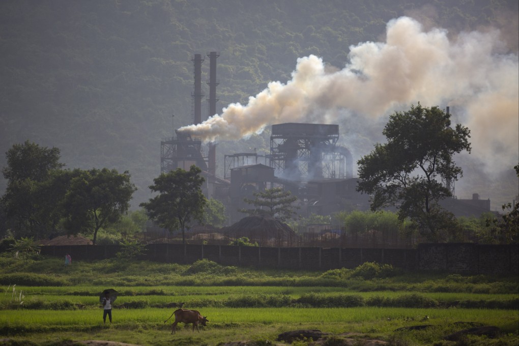 Smoke rises from a coal-powered steel plant at Hehal village near Ranchi, in eastern Jharkhand state, in India. The key priority for India at the upcoming UN climate conference will be how to pay for the transition away from fossil fuels for energy and industries to meet temperature-limit targets, according to a senior official who will be part of the negotiations. Photo: AP